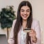Happy working woman with credit card