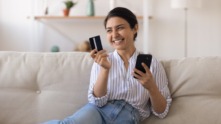 Happy lady with credit card reward points