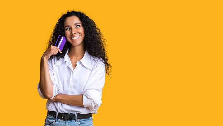 Woman holding her credit card