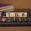 an analog calculator with TDS wooden blocks