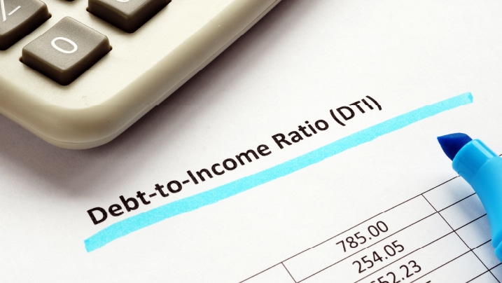 person using a calculator with a pen in hand