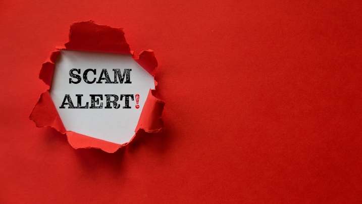 person using a calculator with a pen in hand