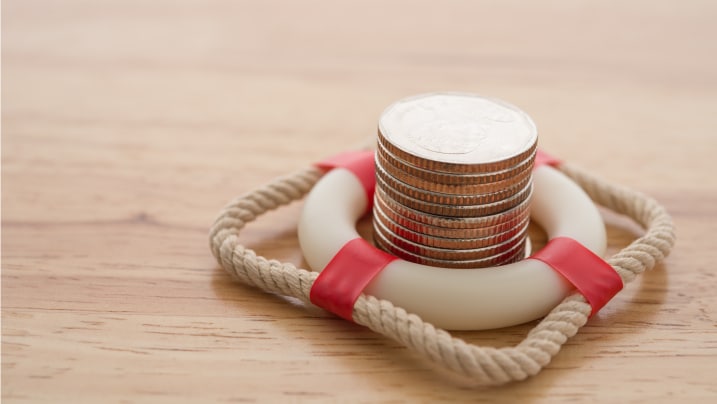 Stacked coins in a lifebelt