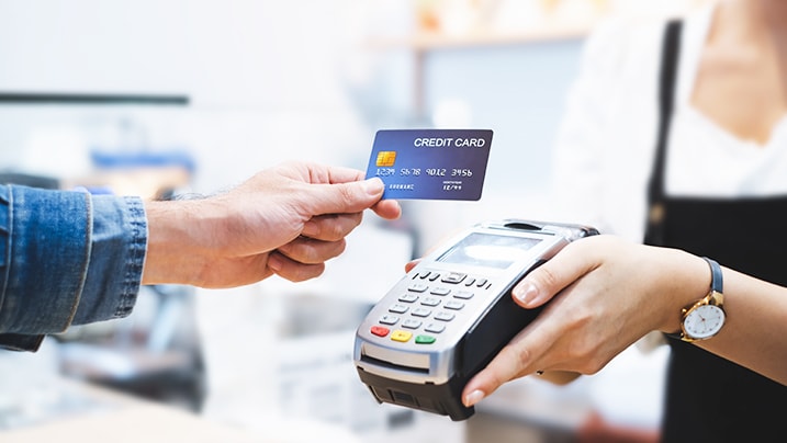 a person performing a credit card transaction