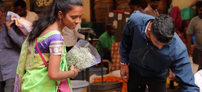 Manisha at the local flower market buying flowers for her bouquet. Manisha is a florist and runs Vinen Flowers and Arts.