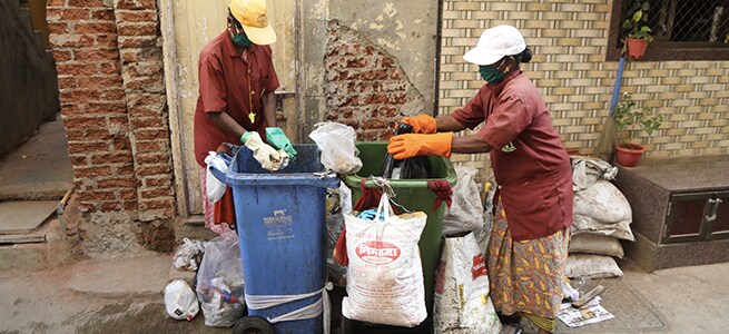 Women check and segregate unsegregated waste