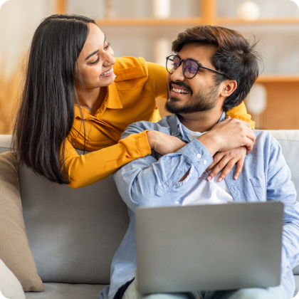 Couple Looking in the Laptop