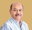 Portrait of Radhakishan Damani, founder of Avenue Supermarts, mobile version