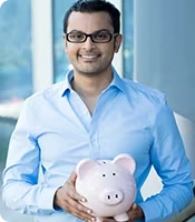Man Holding Piggy Bank