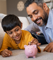 Kid Saving Money in Piggy Bank