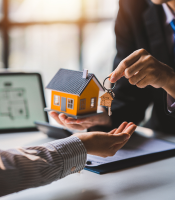 Man Holding Piggy Bank
